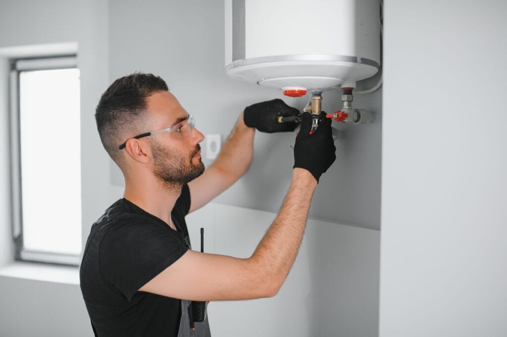 Technician performing water heater maintenance in Altamonte Springs