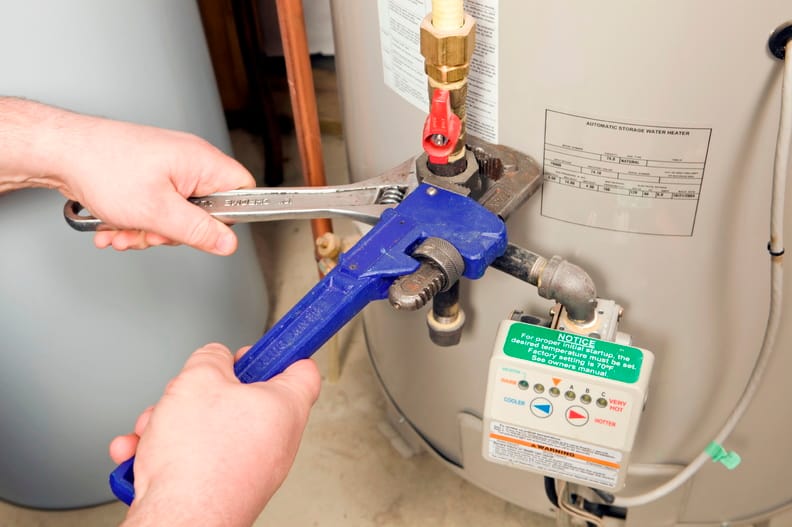 Plumber repairing a water heater valve in Altamonte Springs